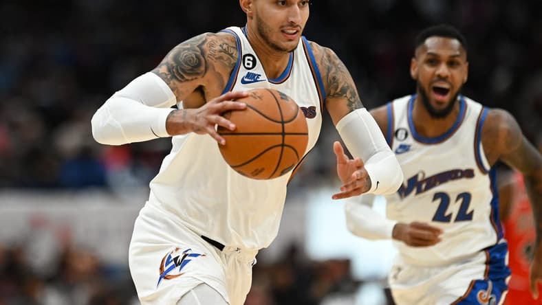 Oct 21, 2022; Washington, District of Columbia, USA; Washington Wizards forward Kyle Kuzma (33) makes a move to the basket as guard Monte Morris (22) reacts during the first half against the Chicago Bulls at Capital One Arena. Mandatory Credit: Tommy Gilligan-USA TODAY Sports