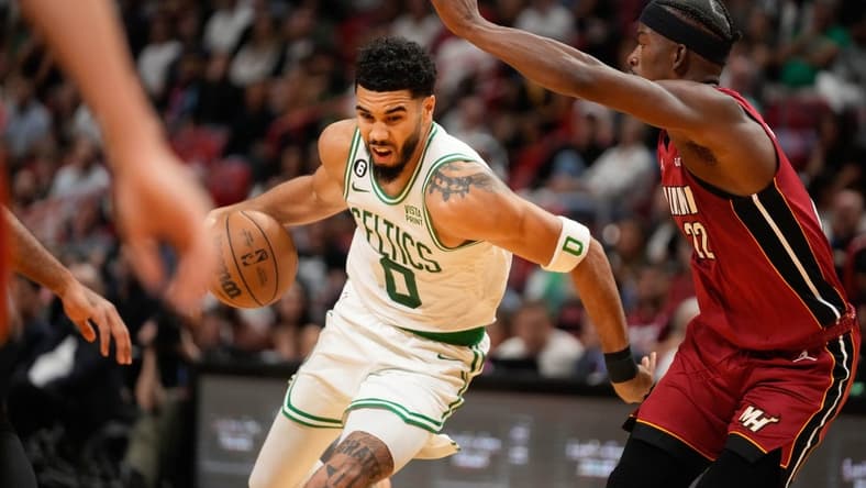 Oct 21, 2022; Miami, Florida, USA; Boston Celtics forward Jayson Tatum (0) dribbles the ball against the Miami Heat during the second quarter at FTX Arena. Mandatory Credit: Rich Storry-USA TODAY Sports