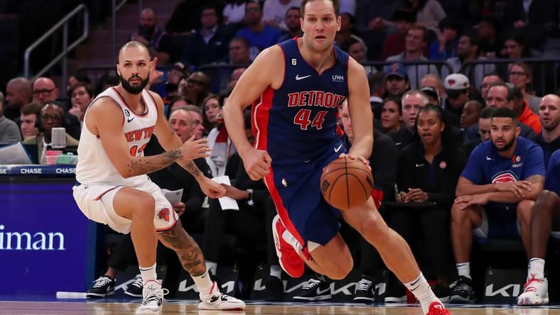 Oct 21, 2022; New York, New York, USA; Detroit Pistons forward Bojan Bogdanovic (44) moves the ball past New York Knicks guard Evan Fournier (13) during the second quarter at Madison Square Garden. Mandatory Credit: Tom Horak-USA TODAY Sports
