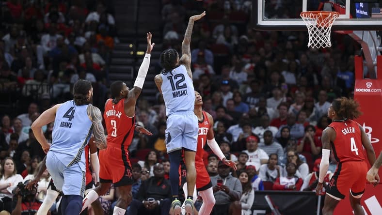 Oct 21, 2022; Houston, Texas, USA; Memphis Grizzlies guard Ja Morant (12) shoots the ball during the fourth quarter against the Houston Rockets at Toyota Center. Mandatory Credit: Troy Taormina-USA TODAY Sports