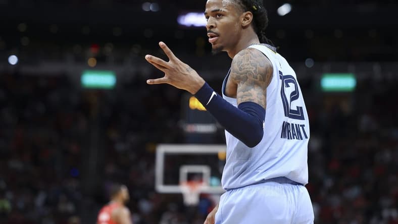 Oct 21, 2022; Houston, Texas, USA; Memphis Grizzlies guard Ja Morant (12) reacts after a play during the fourth quarter against the Houston Rockets at Toyota Center. Mandatory Credit: Troy Taormina-USA TODAY Sports