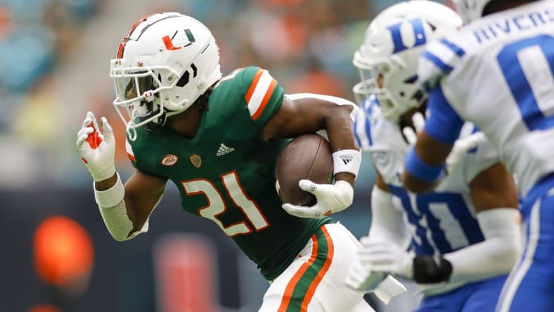Oct 22, 2022; Miami Gardens, Florida, USA; Miami Hurricanes running back Henry Parrish Jr. (21) runs with the football during the first quarter against the Duke Blue Devils at Hard Rock Stadium. Mandatory Credit: Sam Navarro-USA TODAY Sports