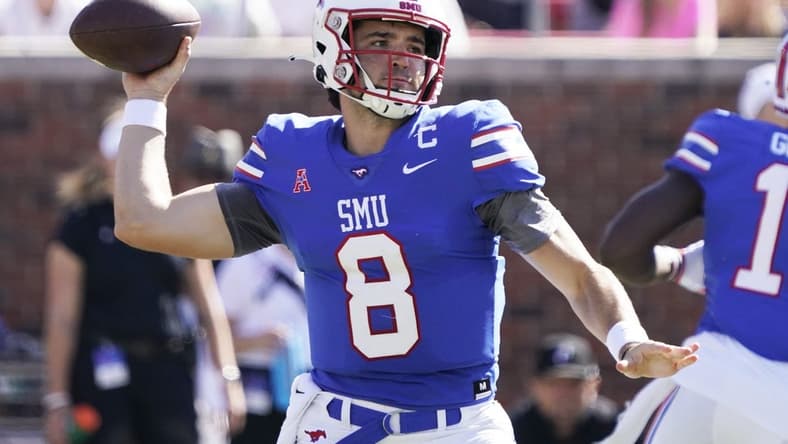 Oct 22, 2022; Dallas, Texas, USA; Southern Methodist Mustangs quarterback Tanner Mordecai (8) throws downfield during the first half against the Cincinnati Bearcats at Gerald J. Ford Stadium. Mandatory Credit: Raymond Carlin III-USA TODAY Sports