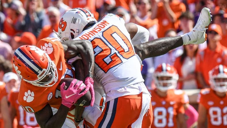 Oct 22, 2022; Clemson, SC, USA; Clemson wide receiver Joseph Ngata (10) gets tackled by Syracuse defensive back Isaiah Johnson (20) during the second quarter at Memorial Stadium in Clemson, South Carolina on Saturday, October 22, 2022.   Mandatory Credit: Ken Ruinard-USA TODAY NETWORK