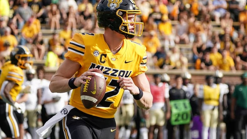 Oct 22, 2022; Columbia, Missouri, USA; Missouri Tigers quarterback Brady Cook (12) throws a pass against the Vanderbilt Commodores during the first half of the game at Faurot Field at Memorial Stadium. Mandatory Credit: Denny Medley-USA TODAY Sports