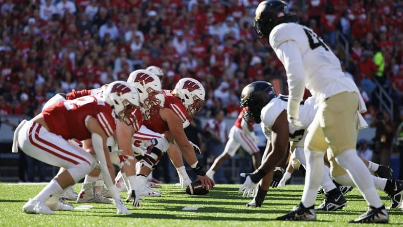 Oct 22, 2022; Madison, Wisconsin, USA;  The Wisconsin Badgers line up for a play during the first quarter against the Purdue Boilermakers at Camp Randall Stadium. Mandatory Credit: Jeff Hanisch-USA TODAY Sports