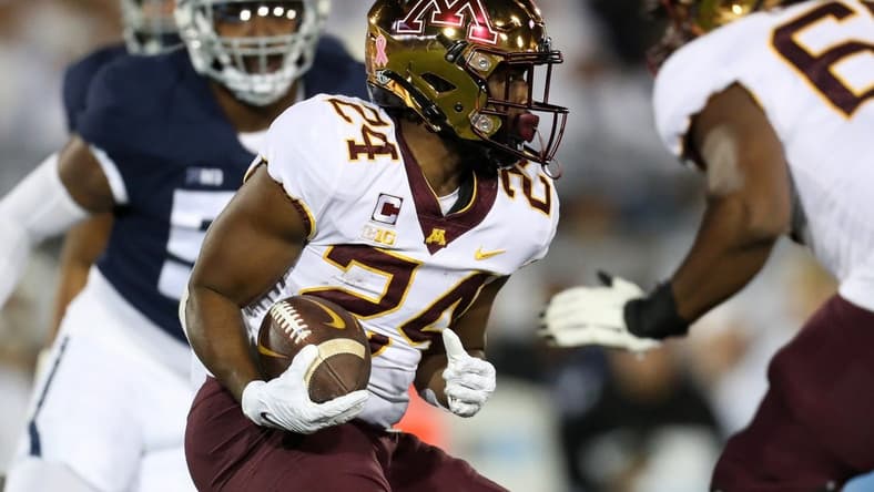 Oct 22, 2022; University Park, Pennsylvania, USA; Minnesota Golden Gophers running back Mohamed Ibrahim (24) runs with the ball during the first quarter against the Penn State Nittany Lions at Beaver Stadium. Mandatory Credit: Matthew OHaren-USA TODAY Sports
