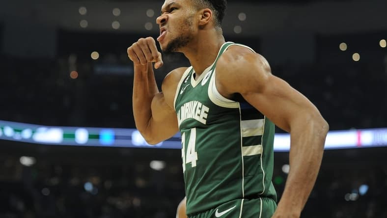 Oct 22, 2022; Milwaukee, Wisconsin, USA; Milwaukee Bucks forward Giannis Antetokounmpo (34) mean mugs to the audience after powering his way to the basket and being fouled by a Houston Rockets player in the first quarter at Fiserv Forum. Mandatory Credit: Michael McLoone-USA TODAY Sports