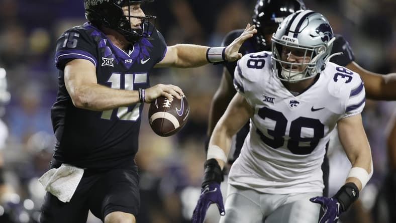 Oct 22, 2022; Fort Worth, Texas, USA; TCU Horned Frogs quarterback Max Duggan (15) scrambles abasing Kansas State Wildcats defensive end Brendan Mott (38) in the first quarter at Amon G. Carter Stadium. Mandatory Credit: Tim Heitman-USA TODAY Sports