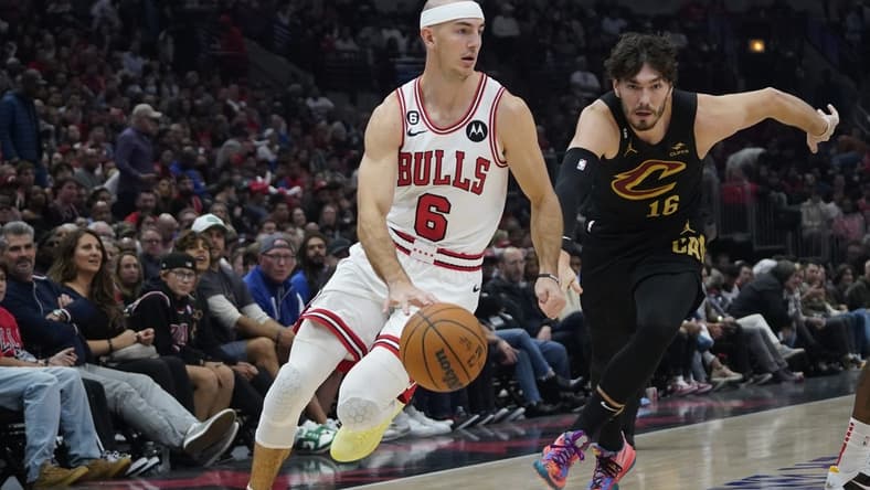 Oct 22, 2022; Chicago, Illinois, USA; Cleveland Cavaliers forward Cedi Osman (16) defends Chicago Bulls guard Alex Caruso (6) during the first quarter at United Center. Mandatory Credit: David Banks-USA TODAY Sports