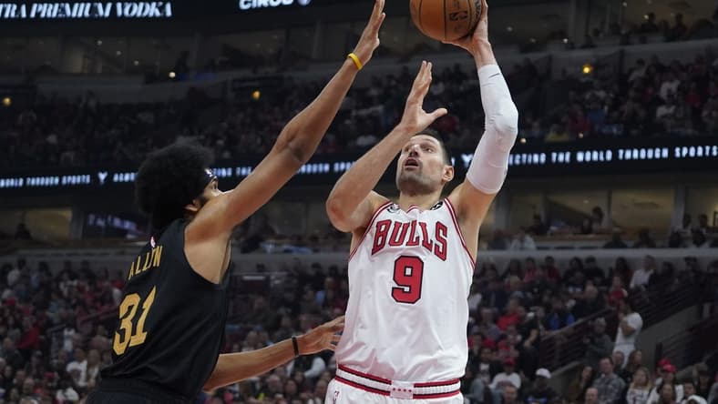 Oct 22, 2022; Chicago, Illinois, USA; Chicago Bulls center Nikola Vucevic (9) shoots Cleveland Cavaliers center Jarrett Allen (31) during the first quarter at United Center. Mandatory Credit: David Banks-USA TODAY Sports