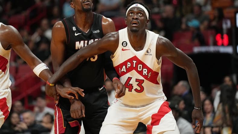 Oct 22, 2022; Miami, Florida, USA; Miami Heat center Bam Adebayo (13) and Toronto Raptors forward Pascal Siakam (43) battle for a rebound in the first half at FTX Arena. Mandatory Credit: Jim Rassol-USA TODAY Sports