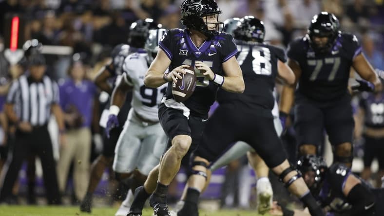 Oct 22, 2022; Fort Worth, Texas, USA; TCU Horned Frogs quarterback Max Duggan (15) rolls out to pass against the Kansas State Wildcats in the first quarter at Amon G. Carter Stadium. Mandatory Credit: Tim Heitman-USA TODAY Sports