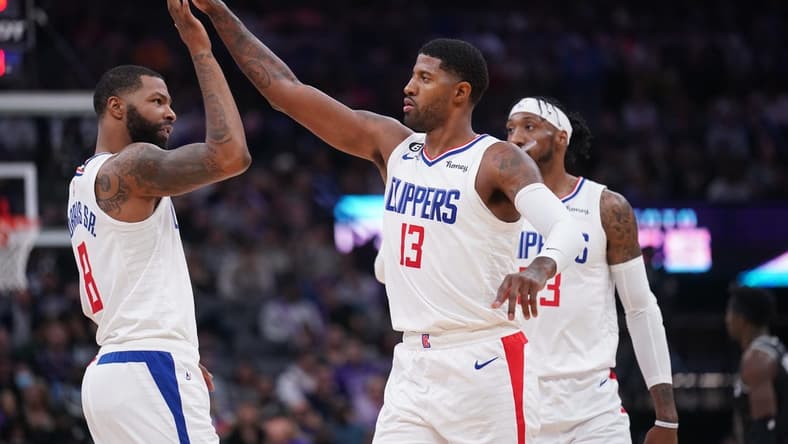 Oct 22, 2022; Sacramento, California, USA; Los Angeles Clippers forward Paul George (13) is congratulated by forward Marcus Morris Sr. (8) after making a three point shot against the Sacramento Kings in the second quarter at the Golden 1 Center. Mandatory Credit: Cary Edmondson-USA TODAY Sports