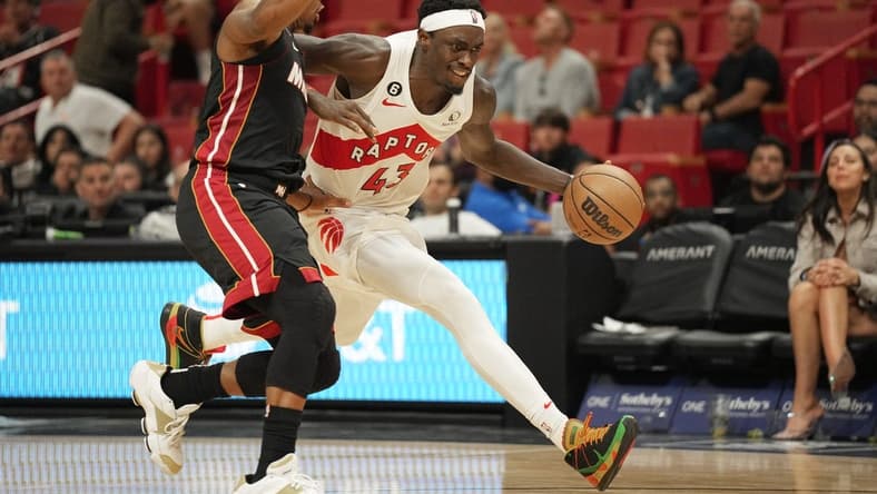 Oct 22, 2022; Miami, Florida, USA; Toronto Raptors forward Pascal Siakam (43) drives against Miami Heat guard Kyle Lowry (7) in the second half at FTX Arena. Mandatory Credit: Jim Rassol-USA TODAY Sports