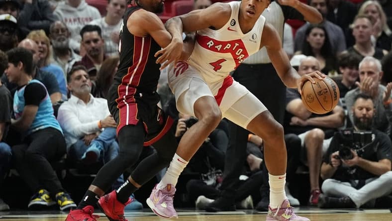 Oct 22, 2022; Miami, Florida, USA; Miami Heat guard Gabe Vincent (2) battles for position against Toronto Raptors forward Scottie Barnes (4) in the first half at FTX Arena. Mandatory Credit: Jim Rassol-USA TODAY Sports