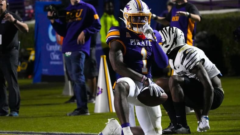 Oct 15, 2022; Greenville, North Carolina, USA; East Carolina Pirates cornerback Malik Fleming (1) celebrates breaking up a pass attempt against the Memphis Tigers during the second half at Dowdy-Ficklen Stadium. Mandatory Credit: James Guillory-USA TODAY Sports