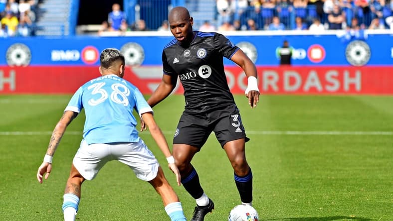 Oct 23, 2022; Montreal, Quebec, Canada; CF Montreal defender Kamal Miller (3) moves the ball against New York City midfielder Gabriel Pereira (38) during the conference semifinals for the Audi 2022 MLS Cup Playoffs at Stade Saputo. Mandatory Credit: Marc DesRosiers-USA TODAY Sports
