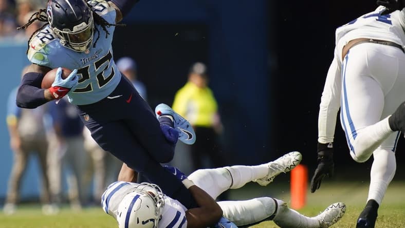 Oct 23, 2022; Nashville, Tennessee, USA; Tennessee Titans running back Derrick Henry (22) is tackled by Indianapolis Colts linebacker E.J. Speed (45) during the third quarter at Nissan Stadium Sunday, Oct. 23, 2022, in Nashville, Tenn.  Mandatory Credit: Andrew Nelles-USA TODAY Sports