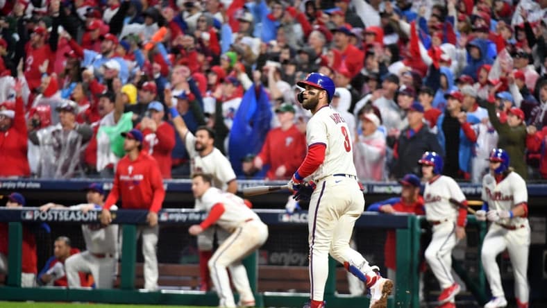 Oct 23, 2022; Philadelphia, Pennsylvania, USA; Philadelphia Phillies designated hitter Bryce Harper (3) hits a two-run home run in the eighth inning during game five of the NLCS against the San Diego Padres for the 2022 MLB Playoffs at Citizens Bank Park. Mandatory Credit: Eric Hartline-USA TODAY Sports