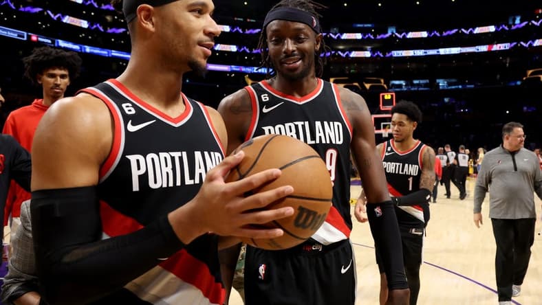 Oct 23, 2022; Los Angeles, California, USA; Portland Trail Blazers guard Josh Hart (11) and forward Jerami Grant (9) celebrate a victory against the Los Angeles Lakers at Crypto.com Arena. Mandatory Credit: Kiyoshi Mio-USA TODAY Sports