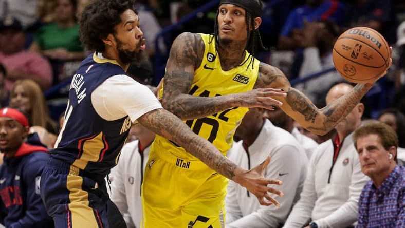 Oct 23, 2022; New Orleans, Louisiana, USA;  Utah Jazz guard Jordan Clarkson (00) looks to pass the ball against New Orleans Pelicans forward Brandon Ingram (14) during the first half at Smoothie King Center. Mandatory Credit: Stephen Lew-USA TODAY Sports