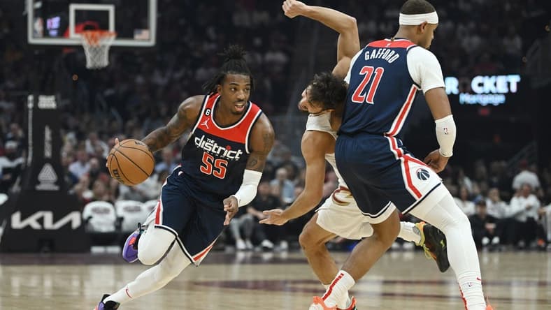 Oct 23, 2022; Cleveland, Ohio, USA; Washington Wizards guard Delon Wright (55) drives to the basket against as center Daniel Gafford (21) picks Cleveland Cavaliers guard Raul Neto (19) during the first half at Rocket Mortgage FieldHouse. Mandatory Credit: Ken Blaze-USA TODAY Sports