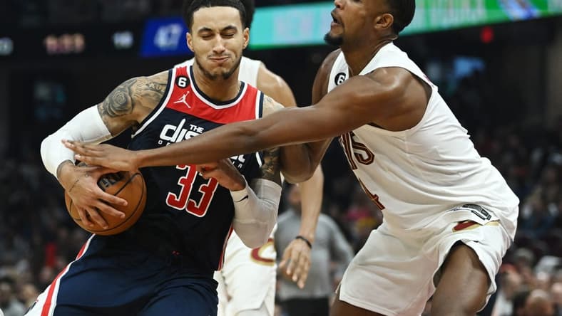 Oct 23, 2022; Cleveland, Ohio, USA; Washington Wizards forward Kyle Kuzma (33) drives to the basket against Cleveland Cavaliers forward Evan Mobley (4) during the first half at Rocket Mortgage FieldHouse. Mandatory Credit: Ken Blaze-USA TODAY Sports