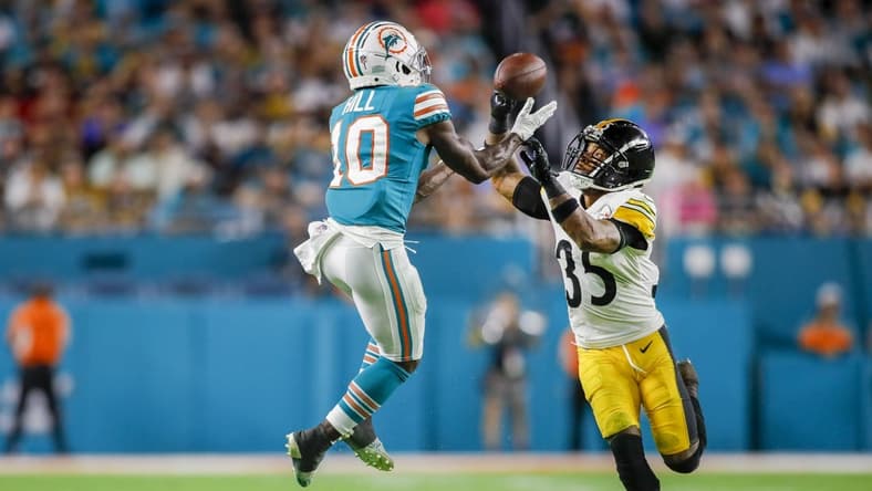 Oct 23, 2022; Miami Gardens, Florida, USA; Miami Dolphins wide receiver Tyreek Hill (10) catches the football over Pittsburgh Steelers cornerback Arthur Maulet (35) during the second quarter at Hard Rock Stadium. Mandatory Credit: Sam Navarro-USA TODAY Sports
