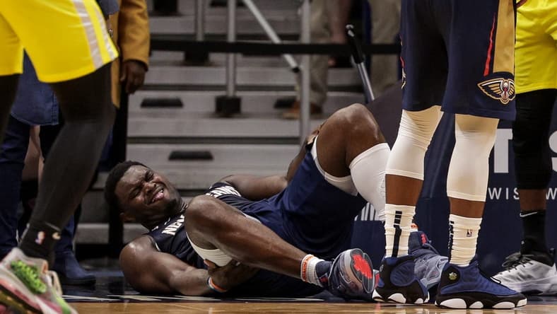 Oct 23, 2022; New Orleans, Louisiana, USA; New Orleans Pelicans forward Zion Williamson (1) is injured on a play by a Utah Jazz player during the second half at Smoothie King Center. Mandatory Credit: Stephen Lew-USA TODAY Sports