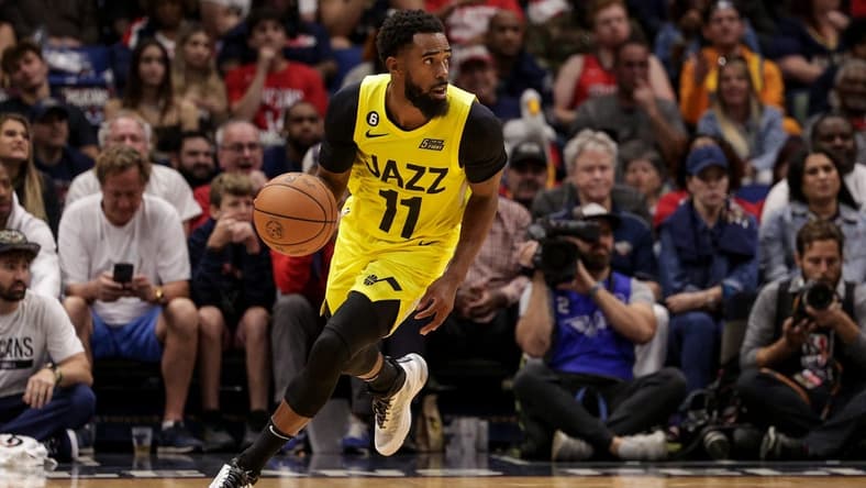 Oct 23, 2022; New Orleans, Louisiana, USA;  Utah Jazz guard Mike Conley (11) brings the ball up court against the New Orleans Pelicans during the second half at Smoothie King Center. Mandatory Credit: Stephen Lew-USA TODAY Sports