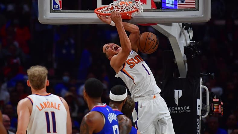 Oct 23, 2022; Los Angeles, California, USA; Phoenix Suns guard Devin Booker (1) dunks for a basket against the Los Angeles Clippers during the second half at Crypto.com Arena. Mandatory Credit: Gary A. Vasquez-USA TODAY Sports