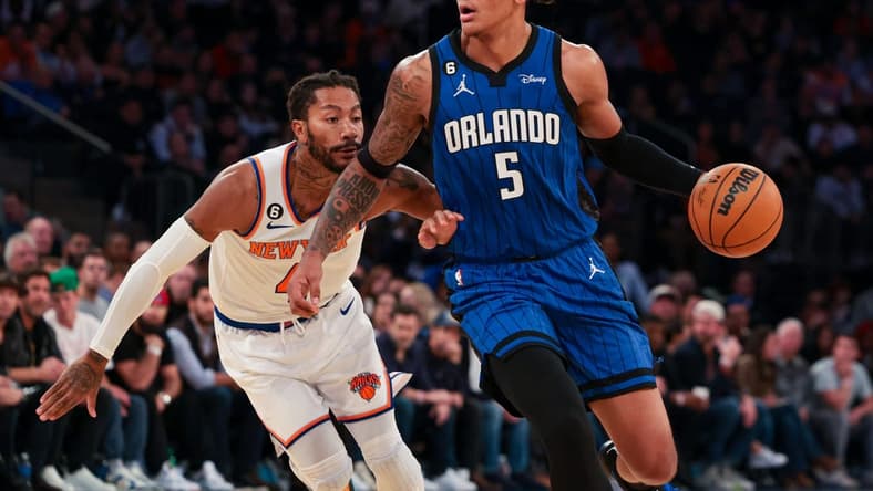 Oct 24, 2022; New York, New York, USA; Orlando Magic forward Paolo Banchero (5) dribbles as New York Knicks guard Derrick Rose (4) defends during the first half at Madison Square Garden. Mandatory Credit: Vincent Carchietta-USA TODAY Sports