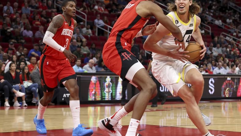 Oct 24, 2022; Houston, Texas, USA; Utah Jazz forward Kelly Olynyk (41) dribbles against Houston Rockets forward Jabari Smith Jr. (1) in the second quarter at Toyota Center. Mandatory Credit: Thomas Shea-USA TODAY Sports