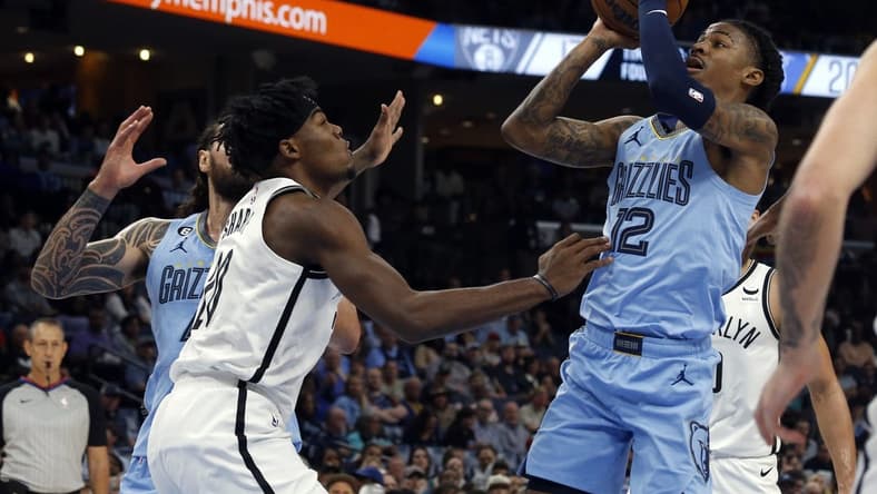 Oct 24, 2022; Memphis, Tennessee, USA;  Memphis Grizzlies guard Ja Morant (12) shoots during the first half against the Brooklyn Nets at FedExForum. Mandatory Credit: Petre Thomas-USA TODAY Sports