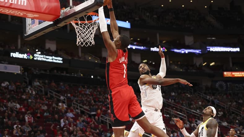 Oct 24, 2022; Houston, Texas, USA; Houston Rockets forward Jabari Smith Jr. (1) dunks against Utah Jazz guard Malik Beasley (5) in the second half at Toyota Center. Mandatory Credit: Thomas Shea-USA TODAY Sports