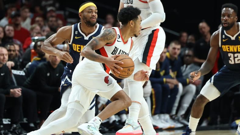 Oct 24, 2022; Portland, Oregon, USA; Portland Trail Blazers guard Anfernee Simons (1) dribbles against the Denver Nuggets in the second half at Moda Center. Mandatory Credit: Jaime Valdez-USA TODAY Sports