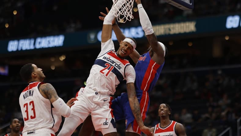 Oct 25, 2022; Washington, District of Columbia, USA; Detroit Pistons center Jalen Duren (0) attempts to dunk the ball as Washington Wizards center Daniel Gafford (21) defends in the second quarter at Capital One Arena. Mandatory Credit: Geoff Burke-USA TODAY Sports