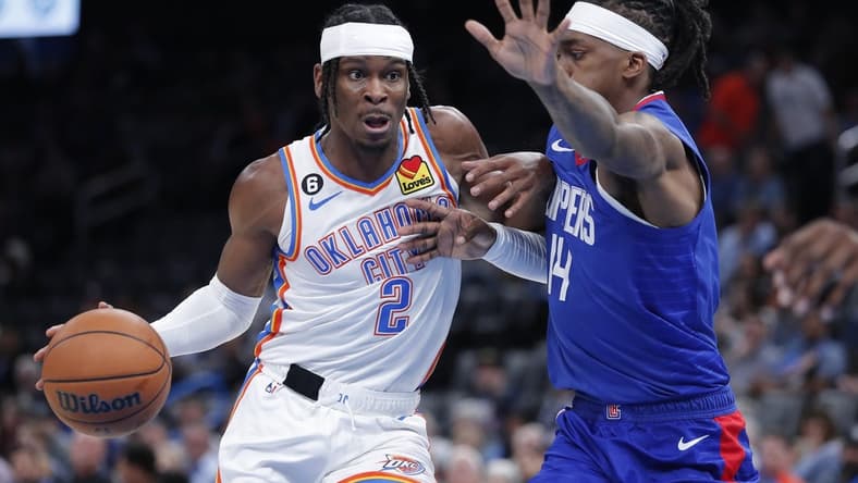 Oct 25, 2022; Oklahoma City, Oklahoma, USA; Oklahoma City Thunder guard Shai Gilgeous-Alexander (2) drives to the basket against LA Clippers guard Terance Mann (14) during the first half at Paycom Center. Mandatory Credit: Alonzo Adams-USA TODAY Sports