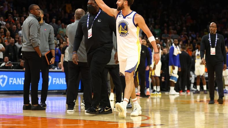 Oct 25, 2022; Phoenix, Arizona, USA; Golden State Warriors guard Klay Thompson waves at the Phoenix Suns bench after being ejected from the game in the second half at Footprint Center. Mandatory Credit: Mark J. Rebilas-USA TODAY Sports