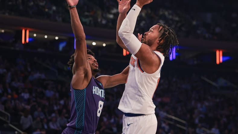 Oct 26, 2022; New York, New York, USA; New York Knicks guard Jalen Brunson (11) shoots the ball as Charlotte Hornets guard Dennis Smith Jr. (8) defends during the first half at Madison Square Garden. Mandatory Credit: Vincent Carchietta-USA TODAY Sports