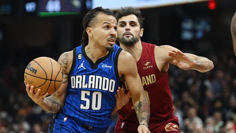 Oct 26, 2022; Cleveland, Ohio, USA; Orlando Magic guard Cole Anthony (50) drives to the basket against Cleveland Cavaliers guard Raul Neto (19) during the first half at Rocket Mortgage FieldHouse. Mandatory Credit: Ken Blaze-USA TODAY Sports
