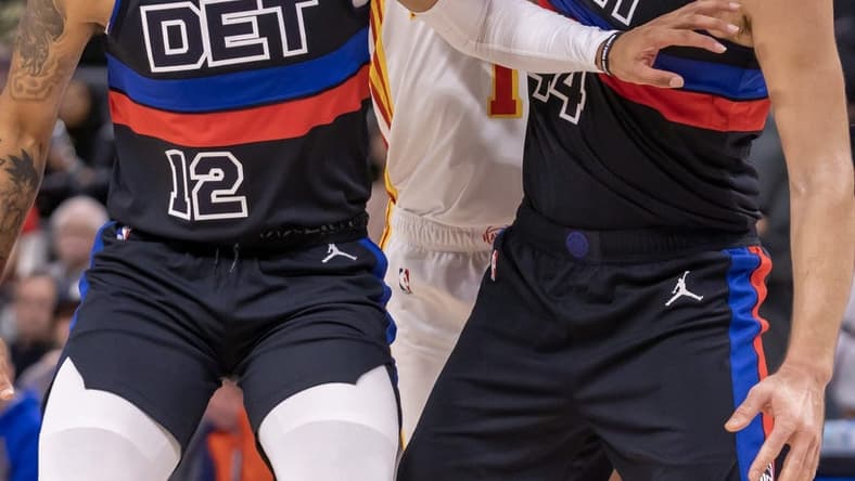 Oct 26, 2022; Detroit, Michigan, USA; Detroit Pistons forward Isaiah Livers (12) and forward Bojan Bogdanovic (44) battles for position with Atlanta Hawks forward Jalen Johnson (1) during the first half at Little Caesars Arena. Mandatory Credit: David Reginek-USA TODAY Sports
