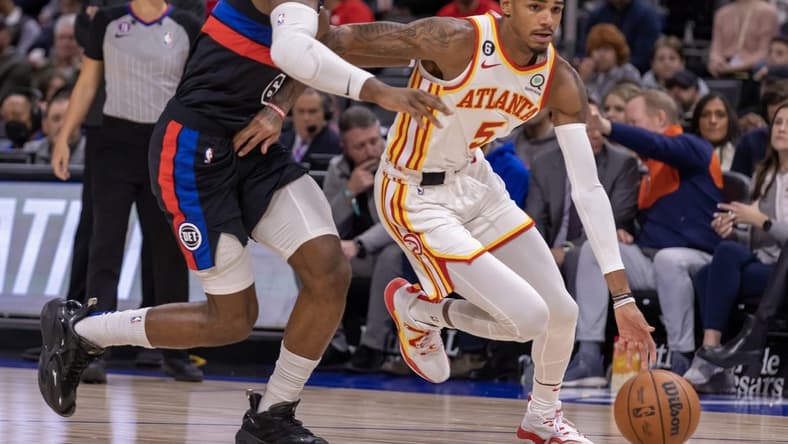 Oct 26, 2022; Detroit, Michigan, USA; Detroit Pistons guard Hamidou Diallo (6) defends against Atlanta Hawks guard Dejounte Murray (5) during the first half at Little Caesars Arena. Mandatory Credit: David Reginek-USA TODAY Sports