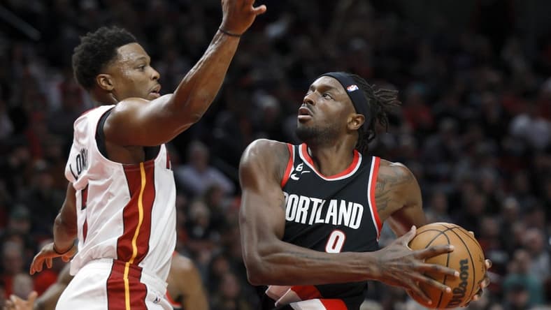 Oct 26, 2022; Portland, Oregon, USA; Portland Trail Blazers small forward Jerami Grant (9) drives to the basket against Miami Heat point guard Kyle Lowry (7) during the first half at Moda Center. Mandatory Credit: Soobum Im-USA TODAY Sports
