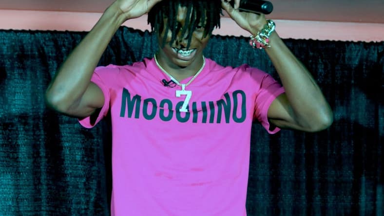 Lakeland's Cormani McClain puts on the baseball cap after choosing Miami.

102722 Rf Mcclain