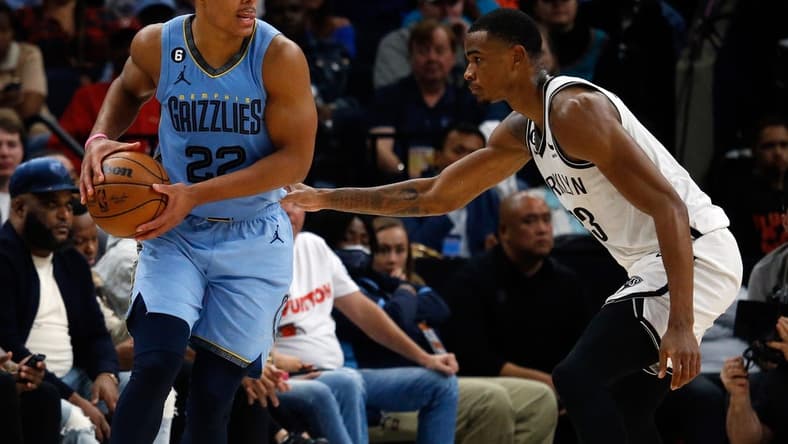 Oct 24, 2022; Memphis, Tennessee, USA; Memphis Grizzlies guard Desmond Bane (22) and Brooklyn Nets forward Nic Claxton (33) during the second half at FedExForum. Mandatory Credit: Petre Thomas-USA TODAY Sports
