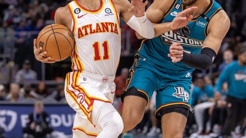 Oct 28, 2022; Detroit, Michigan, USA; Detroit Pistons guard Cade Cunningham (2) defends against Atlanta Hawks guard Trae Young (11) during the first half at Little Caesars Arena. Mandatory Credit: David Reginek-USA TODAY Sports