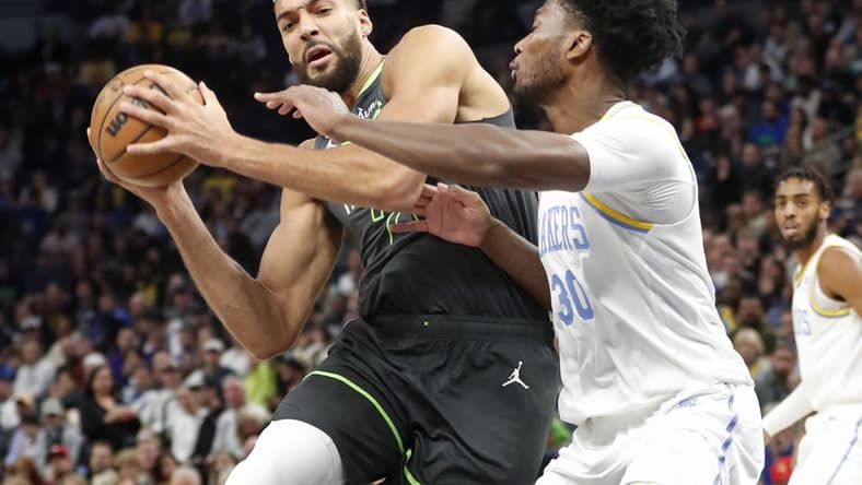 Oct 28, 2022; Minneapolis, Minnesota, USA; Minnesota Timberwolves center Rudy Gobert (27) works against Los Angeles Lakers center Damian Jones (30) in the first quarter at Target Center. Mandatory Credit: Bruce Kluckhohn-USA TODAY Sports