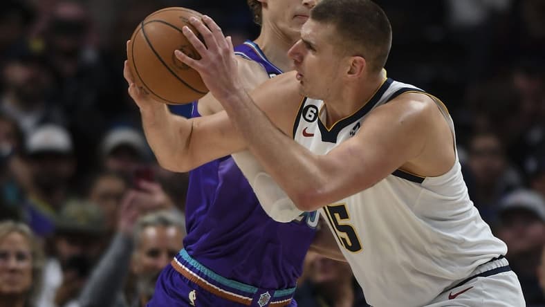Oct 28, 2022; Denver, Colorado, USA; Utah Jazz forward Lauri Markkanen (23) defends against Denver Nuggets center Nikola Jokic (15) during the first quarter at Ball Arena. Mandatory Credit: John Leyba-USA TODAY Sports